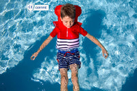 Little boy in water, wearing a Floatee anti-drowning T-shirt which has been triggered (lifejacket inflated automatically)