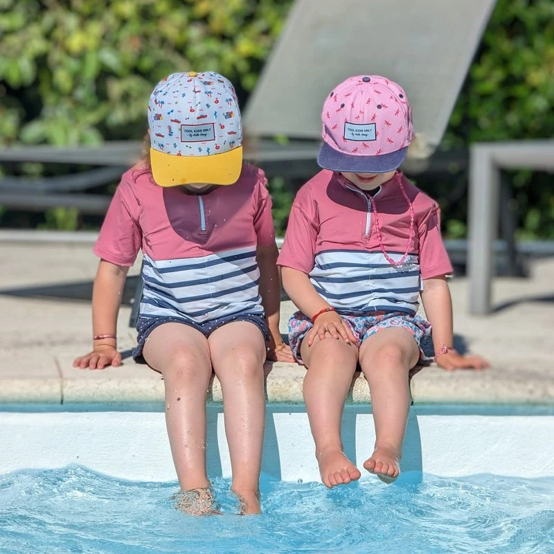 two little girls wearing pink anti-drowning tee-shirt