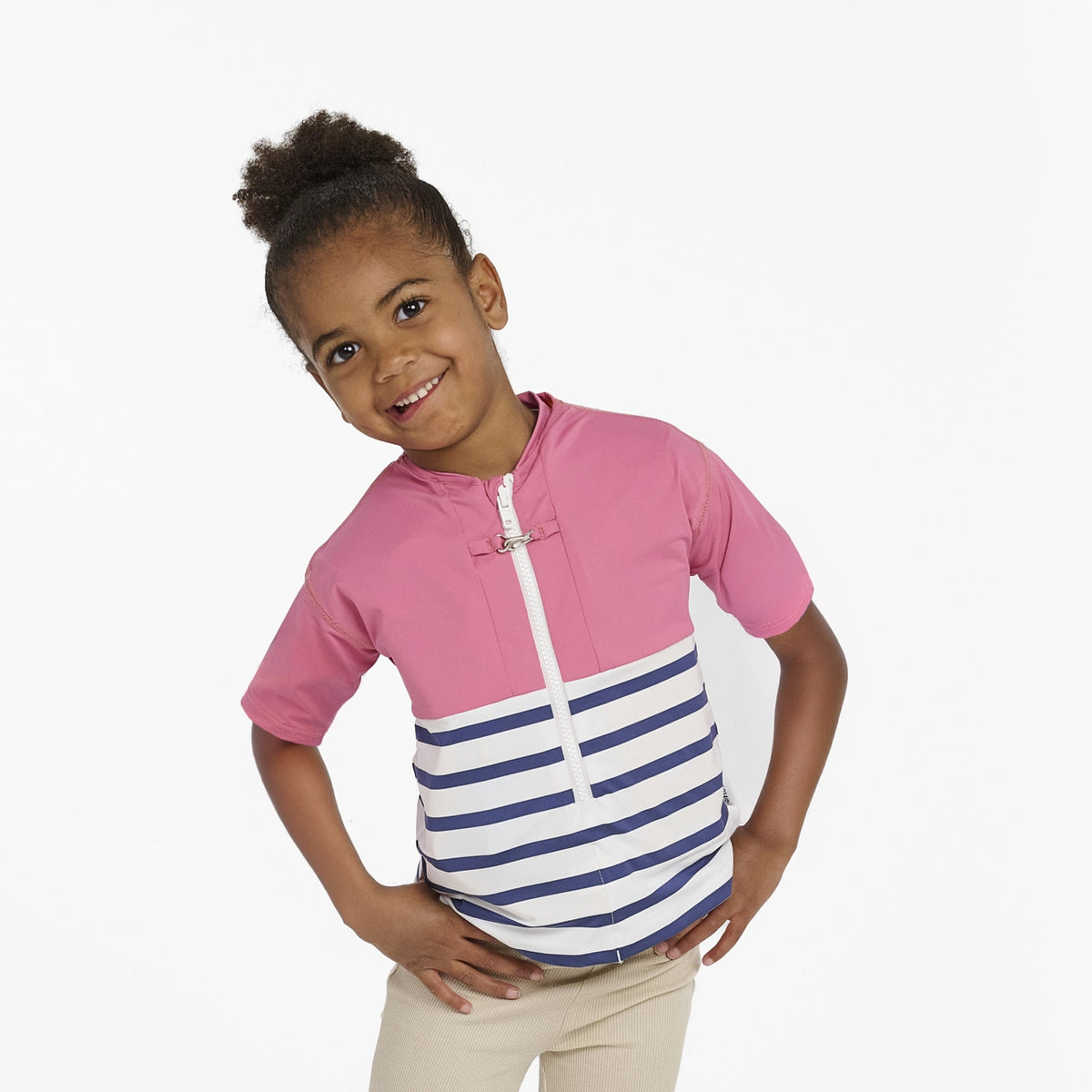 Floatee anti-drowning T-shirt for children, worn by female toddler/kid, pink at the top and striped jersey at the bottom, short sleeves